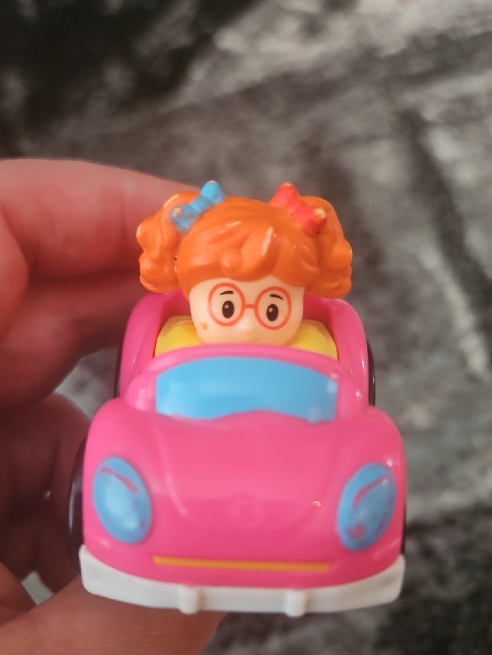 Fisher-Price Little People Wheelies pink bug car featuring a red-head Girl